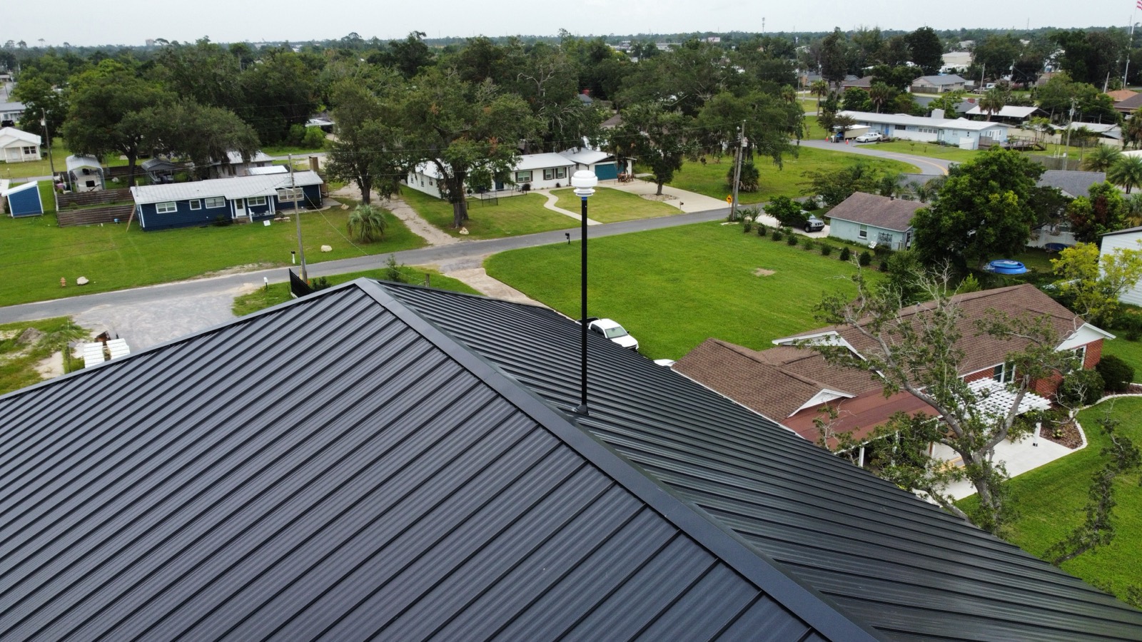 Drone view of lightning protection on a residential standing-seam metal roof